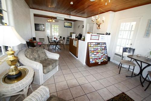 Lobby lounge with wicker armchairs and warm wood ceiling